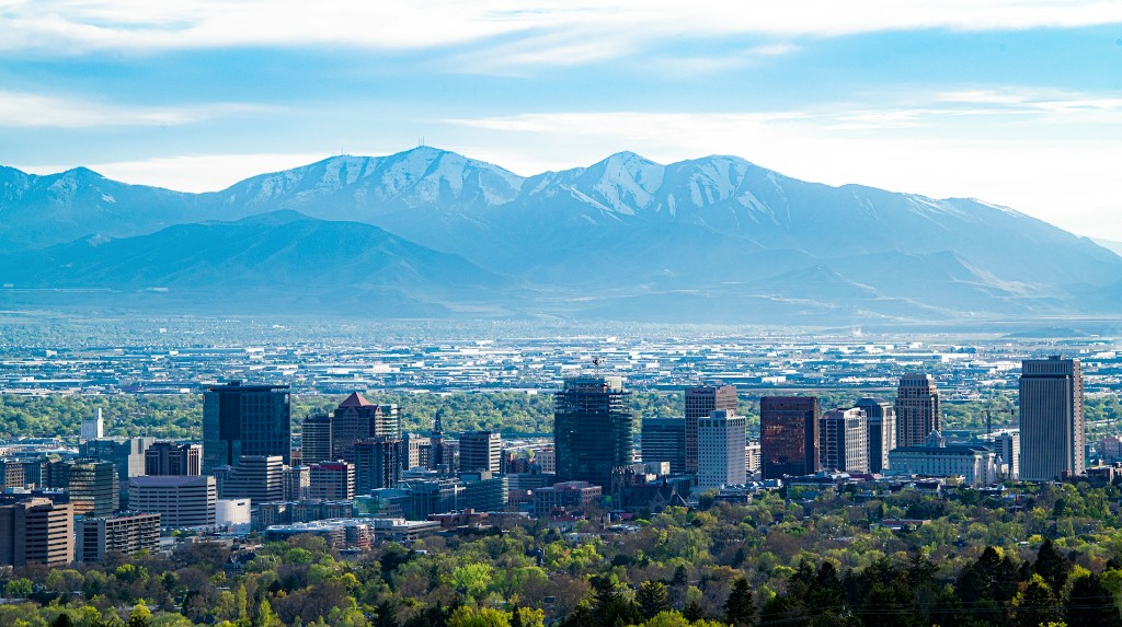 Aerial view of Salt Lake City at dusk with the Wasatch Mountains